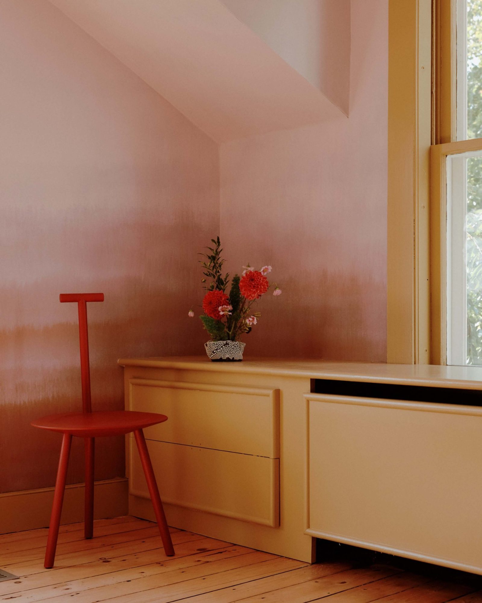 Colorful millwork and furniture accompanies a Calico wallcovering in a guest room.